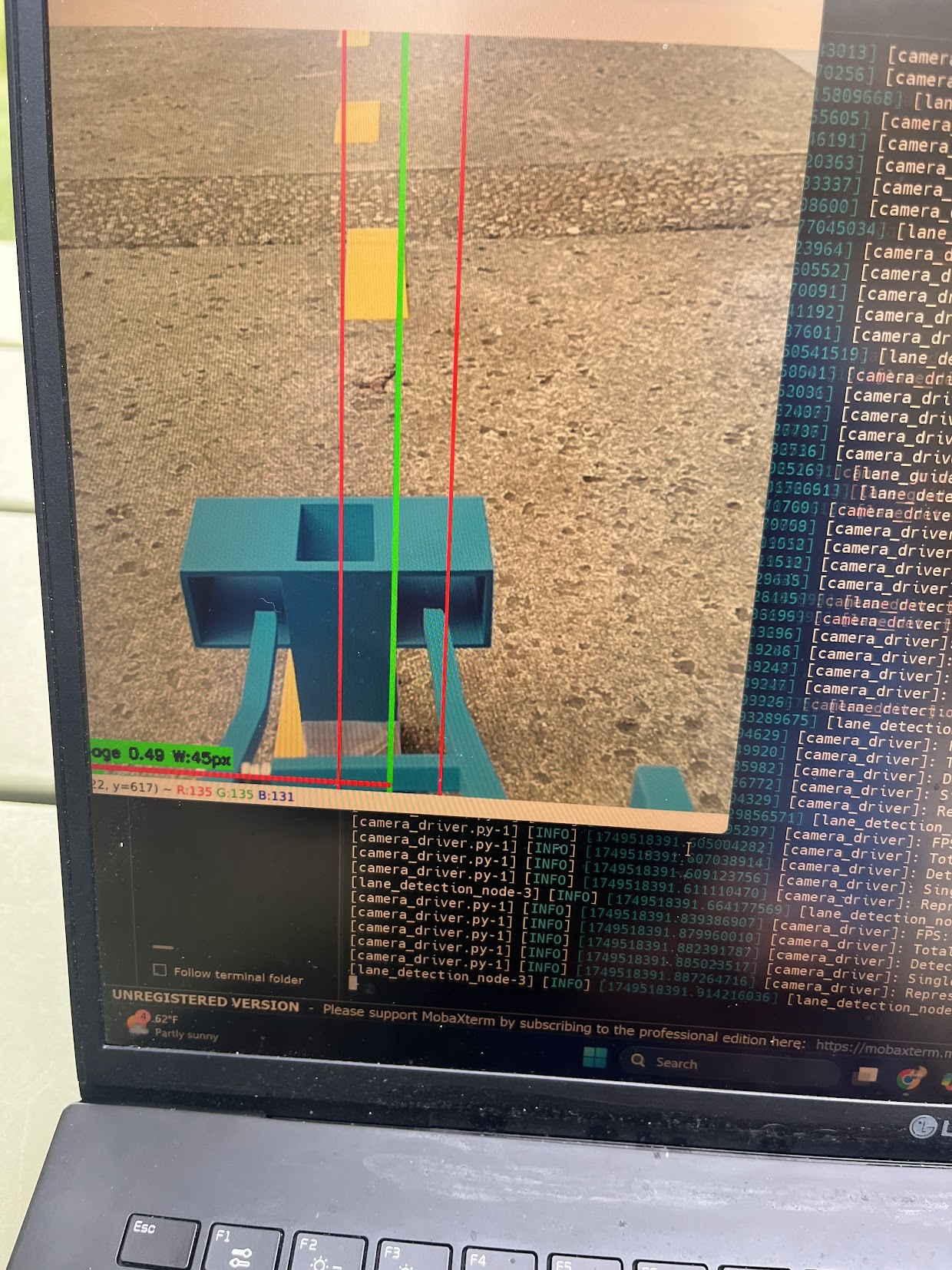The car's camera view with detected lane lines overlaid, running live